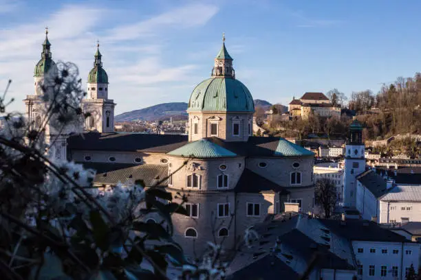 Salzburg, Austria - March 5, 2017: The view of Salzburg  Cathedral (Cathedral of Saints Rupert and Vergilius) and the old town from the Hohensalzburg Castle.