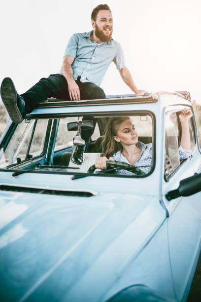 istock Young Couple Having Fun While Traveling In Retro-Style Car 996441754