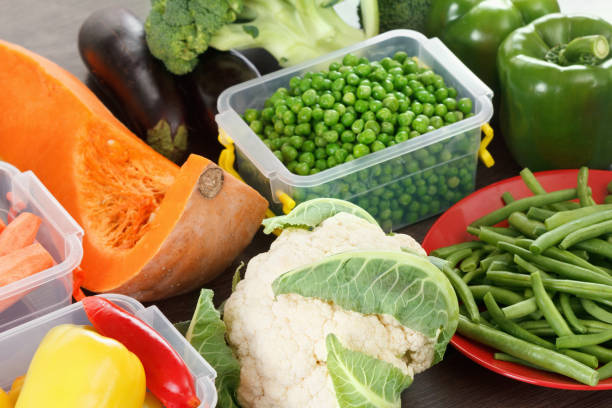 istock Trays with raw vegetables for freezing. 996481806