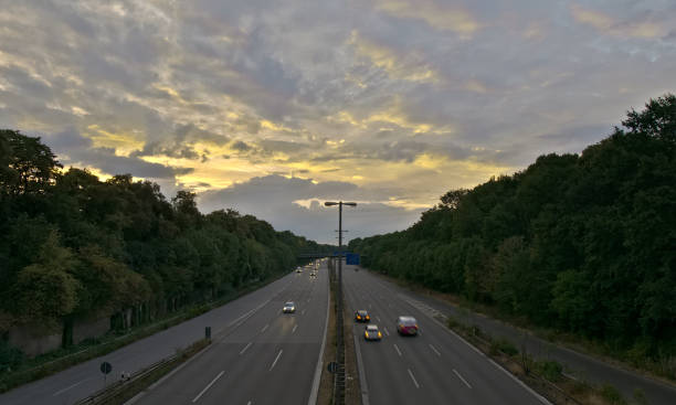 istock Traffic on germany highway in the evening under glowing clouds 996484250