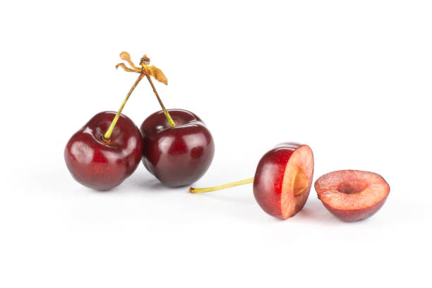 istock Fresh raw sweet red cherry isolated on white 996487172