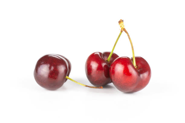 Fresh raw sweet red cherry isolated on white