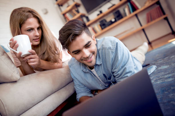 istock Cheerful young couple enjoying at home 996495476