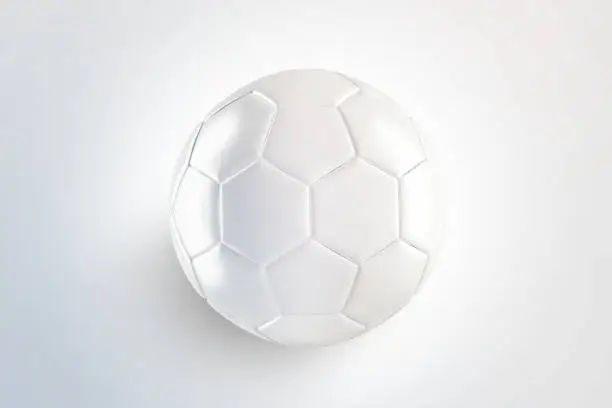 Blank white glossy leather soccer ball mock up, top view, isolated on surface, 3d rendering. Empty football sphere mockup, isolated. Clear sport bal for playing on the clean field template