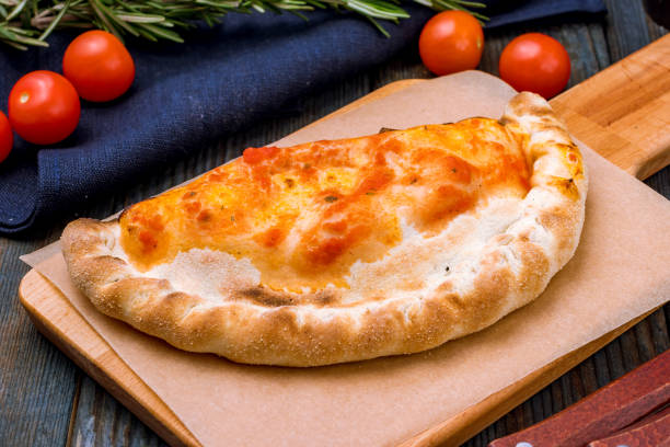 Closed calzone pizza stock photo