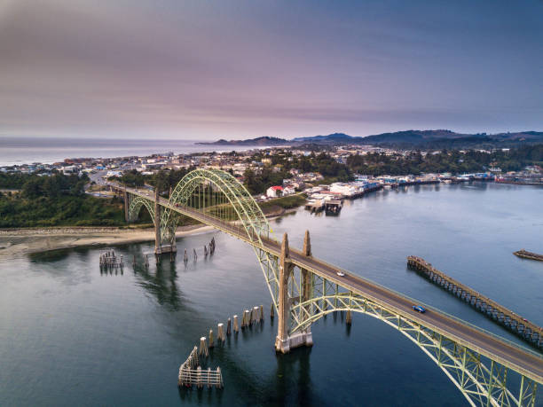 aerial view of yaquina bay bridge and newport, oregon - newport oregon imagens e fotografias de stock