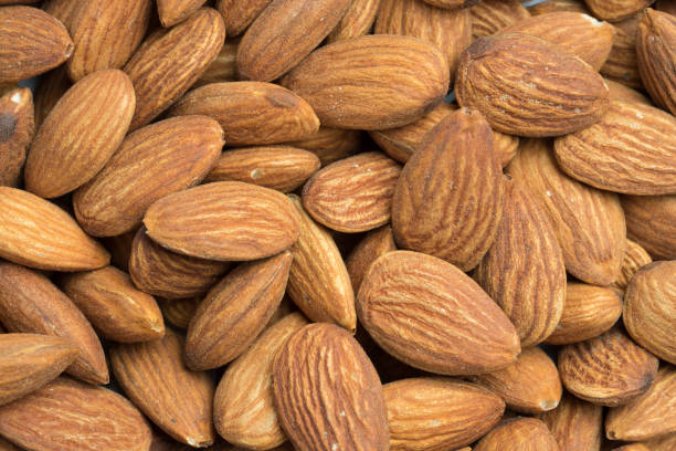 istock closeup of almonds background 996520120
