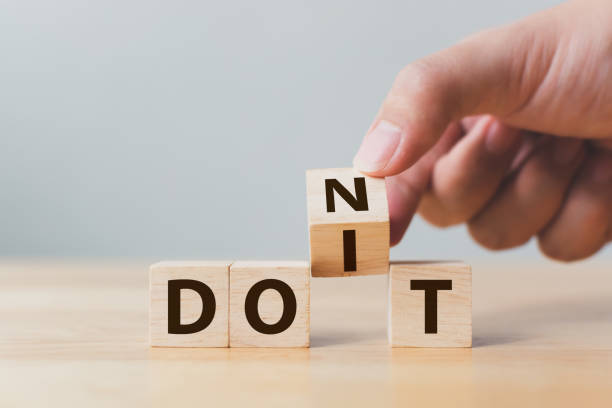 Hand flip wooden cube block with word don’t change to do it. Personal development and career growth or change yourself concept