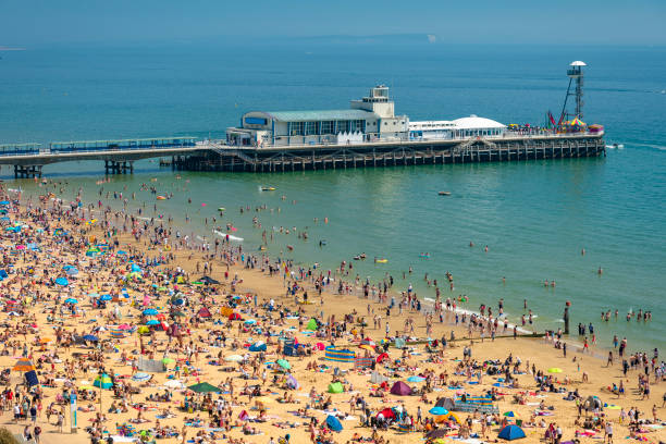 istock Sunbathers pack Bournemouth beach near the Pier 996558610