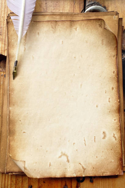 old paper on brown wood texture with pen for background