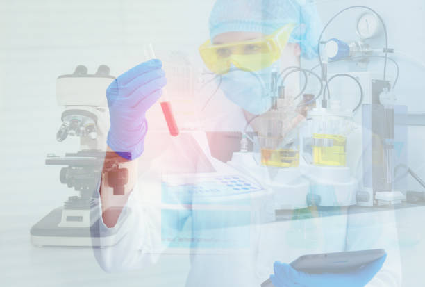 istock Researcher bio technology is looking at chemical reaction in beaker testing, Laboratory testing and double exposure concept 996576636