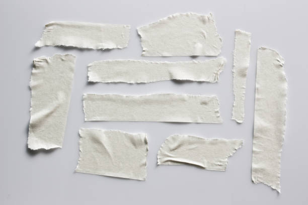 istock Set of white tapes on gray background. Torn horizontal and different size white sticky tape, adhesive pieces. 996579670