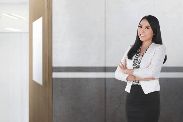 istock Pretty asian female teacher standing 996582596