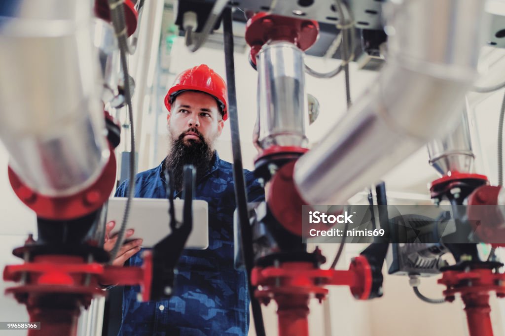 Ork Engineer Stationary Engineer At Work Stock Photo - Download Image Now - Adult ...
