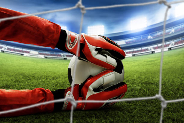 istock Soccer goalkeeper catches the ball 996585768