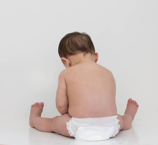 istock Baby wear white diaper sit in white background, back shot 996588636
