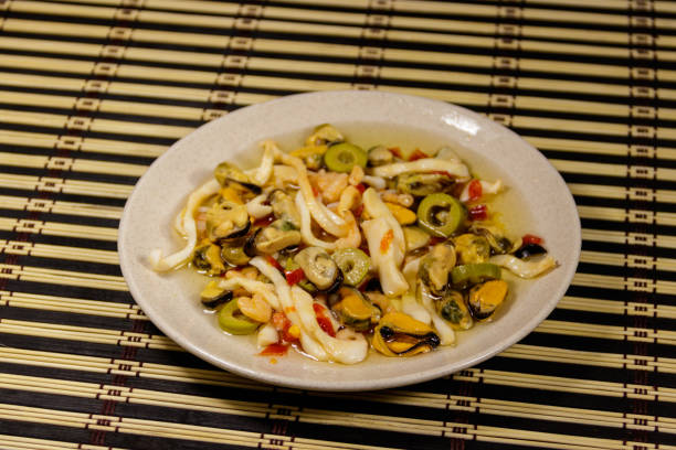 istock Seafood salad with shrimp, squid and mussels on bamboo mat 996594880