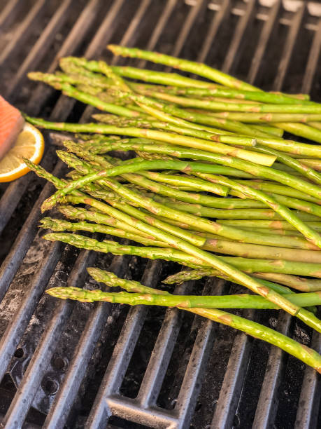 istock Grilling salmon with lemons on outdooor gas grill. 996595078
