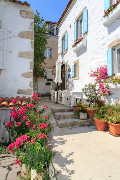 Photo of Vintage street of Alacati with flowers in Cesme, Izmir, Turkey