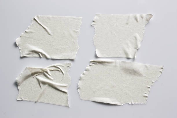 istock Set of white tapes on gray background. Torn horizontal and different size white sticky tape, adhesive pieces. 996603636