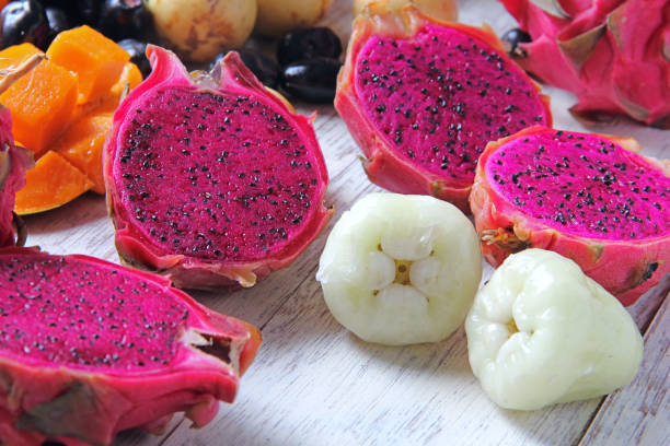 istock Fruits are on wooden background. 996606414