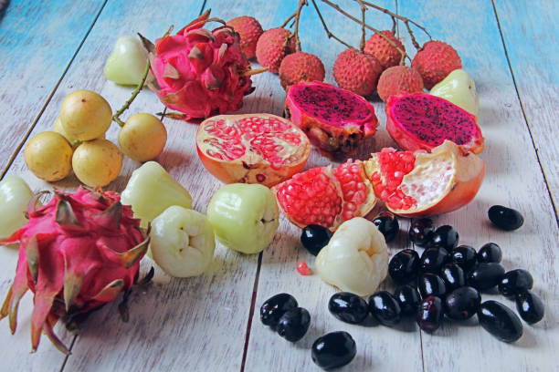 Fruits are on wooden background.