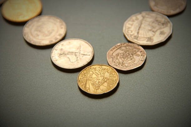 istock Drawing of a line with white different coins on blackboard. Different currencies are stack on the board. The photo may use as financial background. 996606478