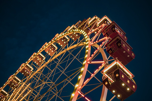 Ferris wheel in a night park. entertainment in the park