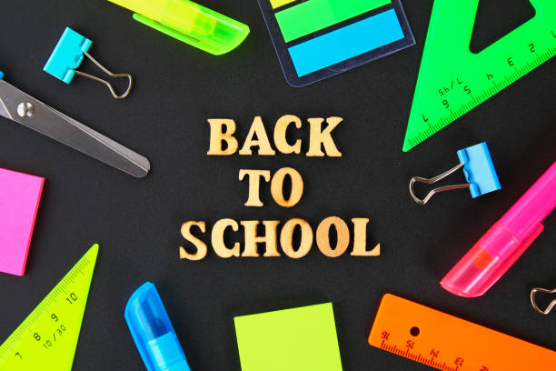 istock School supplies on blackboard background ready for your design. Flat lay. Top view. 996611786