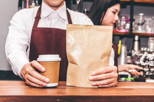 istock Barista giving coffee cup to customer at cafe 996621138