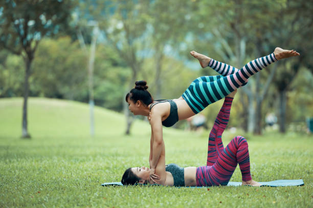 istock Asian women preparing for Acroyoga stag pose 996621850