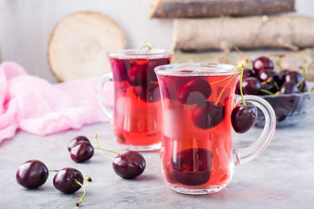 istock Sweet cold compote made from fresh cherries in a glass cup 996622490
