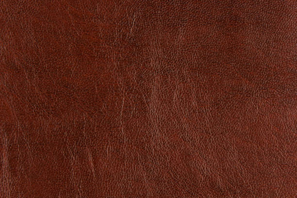 istock Brown Artificial synthetic leather texture background and designing 996633796
