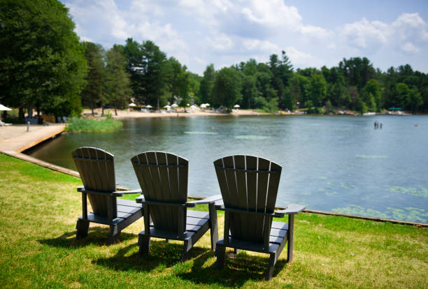 istock Muskoka chairs on a green field 996636326