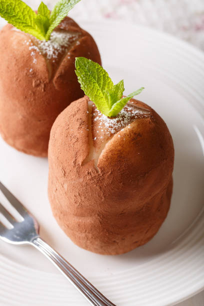 istock Chocolate Potato cakes with mint and cocoa powder on a plate. vertical 996653304