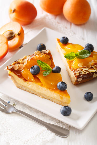 istock Apricot pie with blueberries and nuts close-up. vertical 996653334