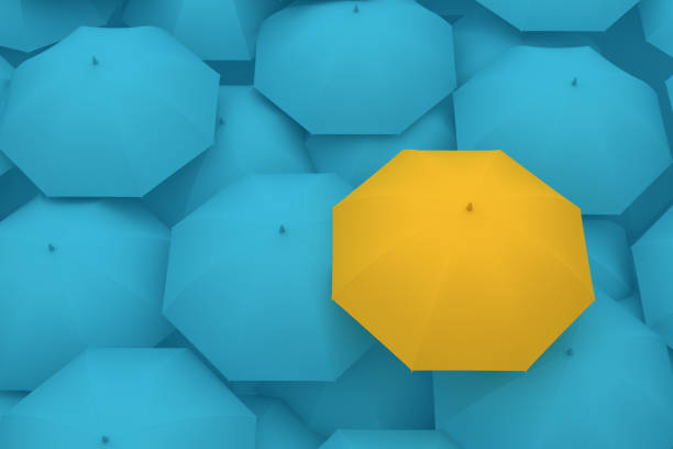 istock Umbrella Standing Out From The Crowd 996658756
