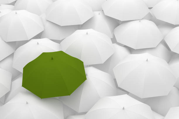 istock Umbrella Standing Out From The Crowd 996658988