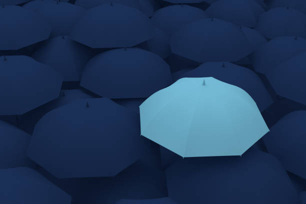 istock Umbrella Standing Out From The Crowd 996659170