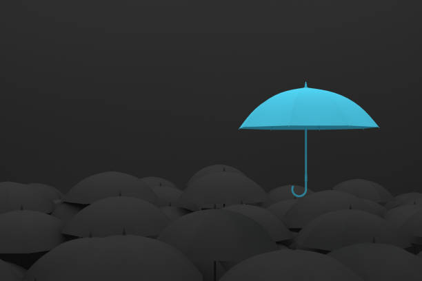 istock Umbrella Standing Out From The Crowd 996659432