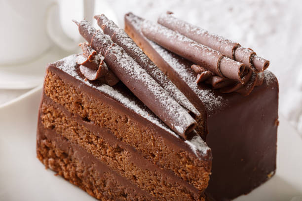 istock Truffle cake with chocolate decor and powdered sugar on a plate macro. horizontal 996666278