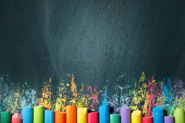 istock Colorful crayons on the blackboard, drawing. Back to school background 996667068