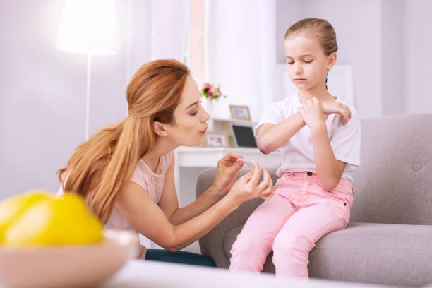 istock Nice young woman blowing at the wound 996678890