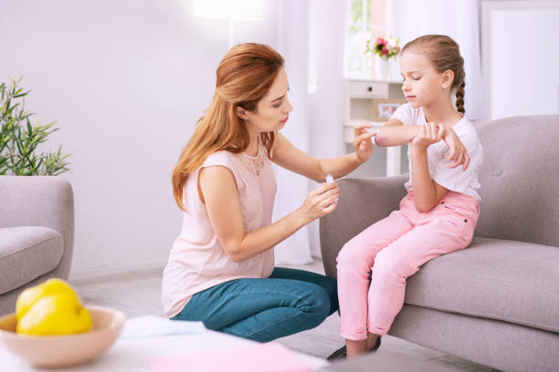 istock Pleasant nice woman helping her daughter 996678922