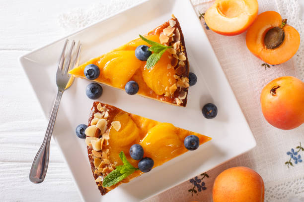 istock Apricot pie with blueberries and nuts close-up on a plate. horizontal top view 996684422