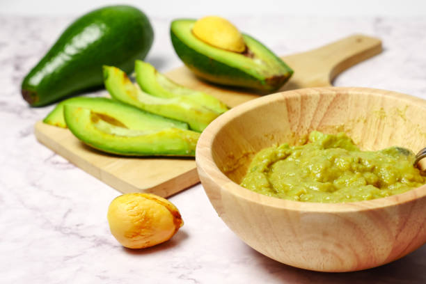 istock Guacamole sauce with avocado on marble table 996686696
