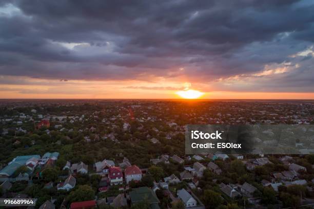 Aerial View Of Residential Houses Neighborhood And Apartment Building Complex At Sunset Stock Photo - Download Image Now