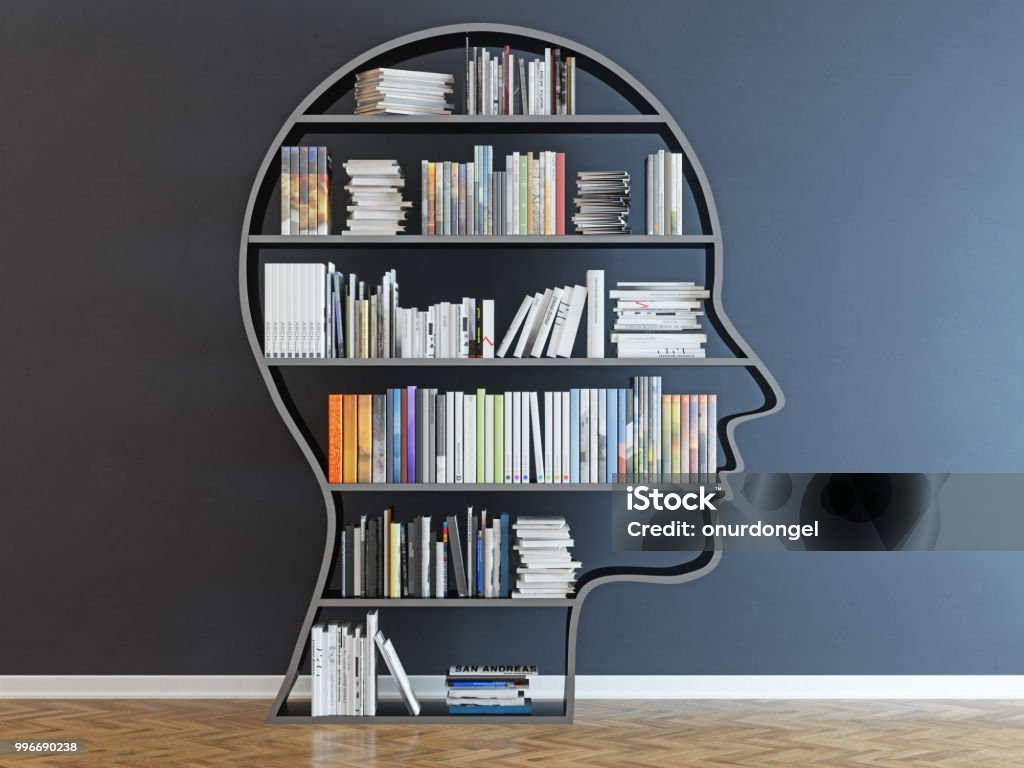 Head with a bookshelf in front of black wall Expertise Stock Photo