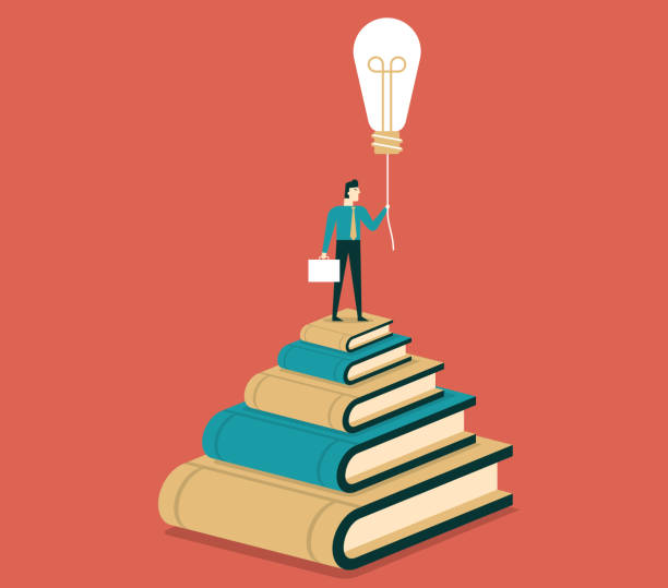 istock Businessman standing on top of books 996692348