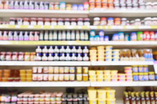 istock Supermarket product shelves display abstract blur background 996692472